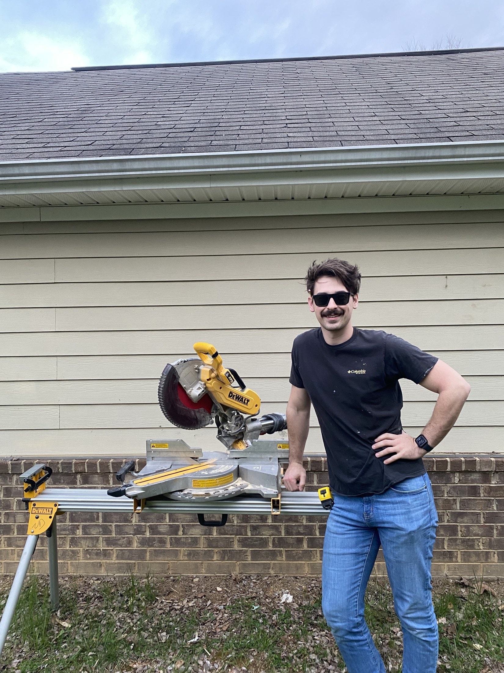 Nicholas Dunn at a miter saw